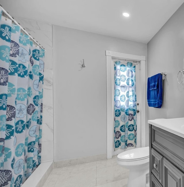 bathroom with toilet, vanity, and a shower with shower curtain