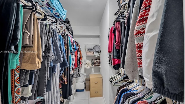 spacious closet featuring tile patterned floors