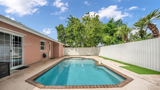 view of swimming pool with a fenced in pool, a fenced backyard, and a patio