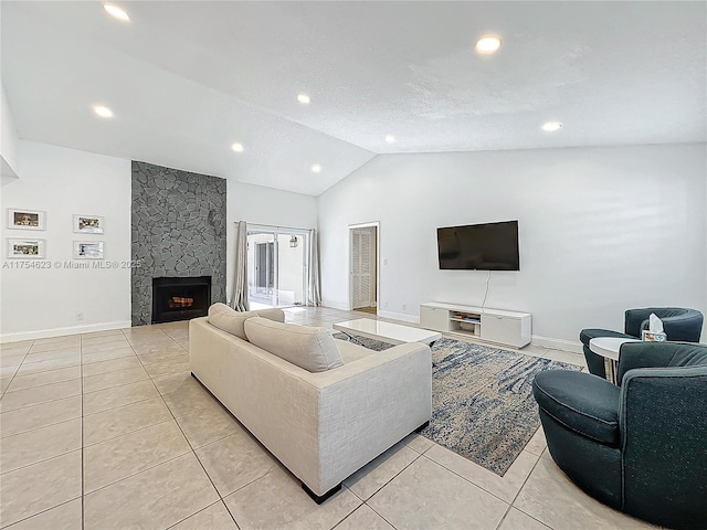 living room featuring light tile patterned floors, a fireplace, lofted ceiling, and baseboards