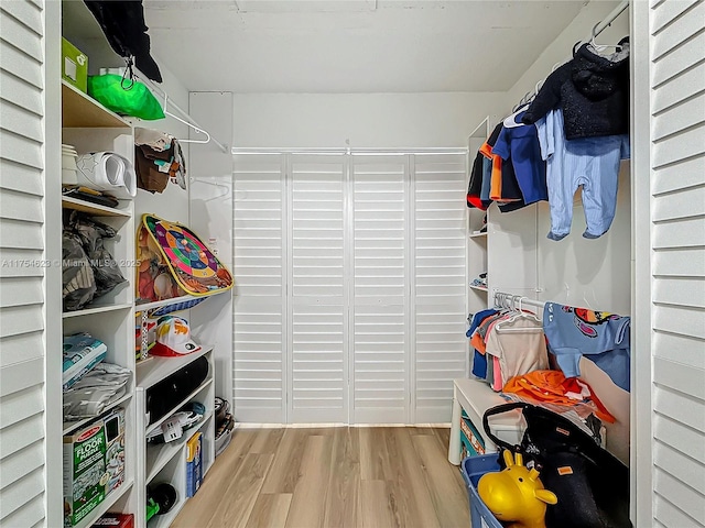 spacious closet with wood finished floors