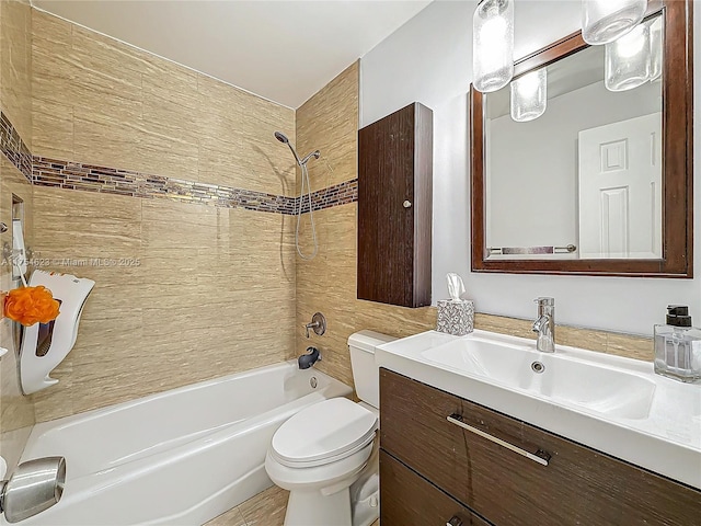 bathroom with vanity, bathtub / shower combination, and toilet