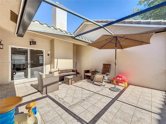 view of patio / terrace with a lanai and an outdoor living space