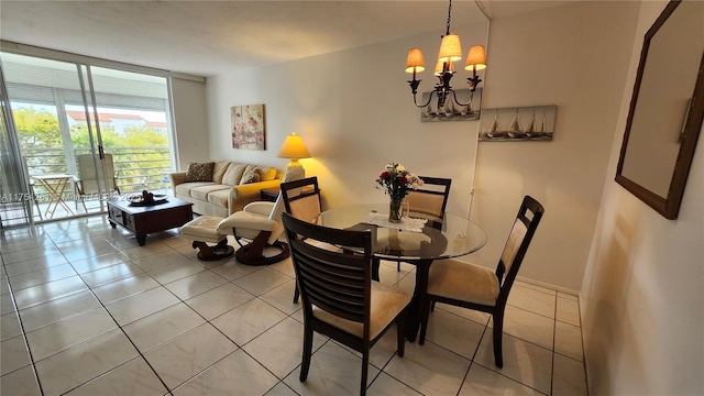 dining area with a wall of windows, a chandelier, baseboards, and light tile patterned floors