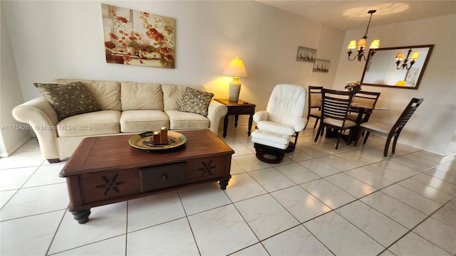 living area with light tile patterned floors and an inviting chandelier