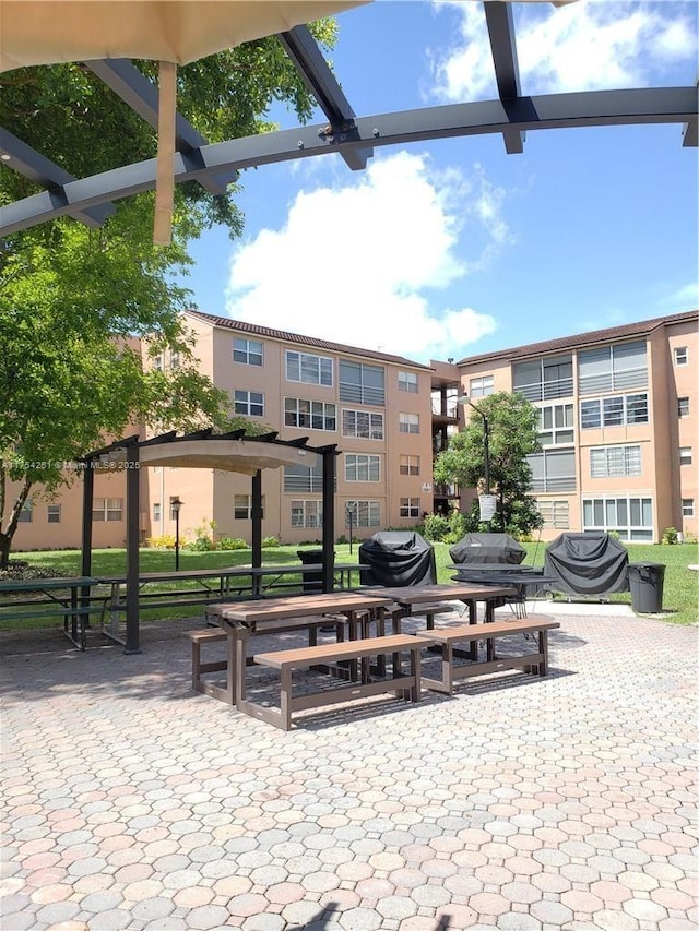 view of property's community featuring a patio area