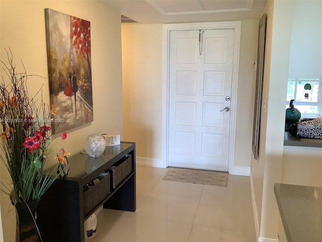 entrance foyer with tile patterned flooring, visible vents, and baseboards