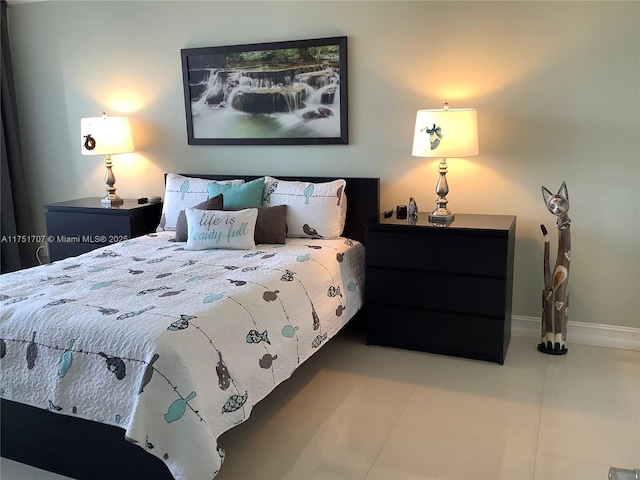 tiled bedroom with baseboards