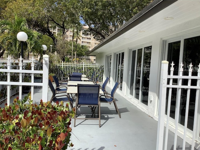 view of patio / terrace with outdoor dining area and fence