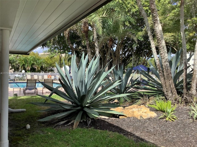 exterior space with a fenced in pool and fence