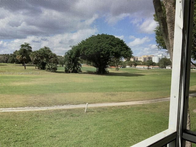 view of property's community with a lawn