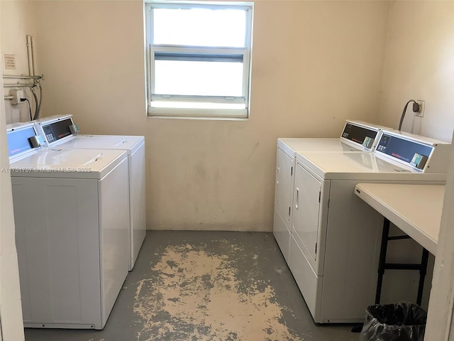 community laundry room with washing machine and clothes dryer