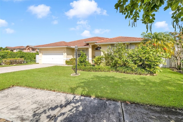 mediterranean / spanish home featuring driveway, a tiled roof, an attached garage, a front lawn, and stucco siding