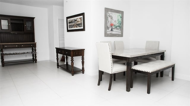dining area featuring baseboards