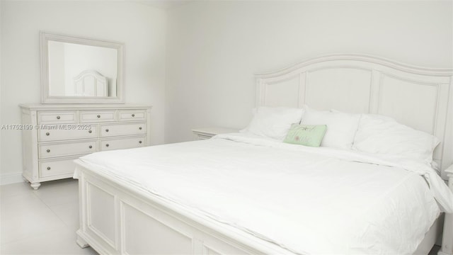 bedroom featuring light tile patterned floors