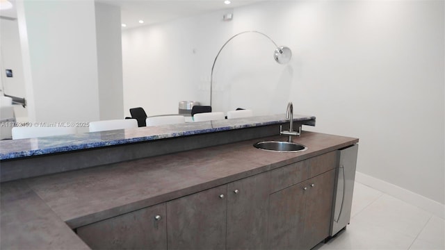bathroom with recessed lighting, tile patterned flooring, baseboards, and vanity