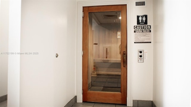 view of sauna featuring tile patterned floors