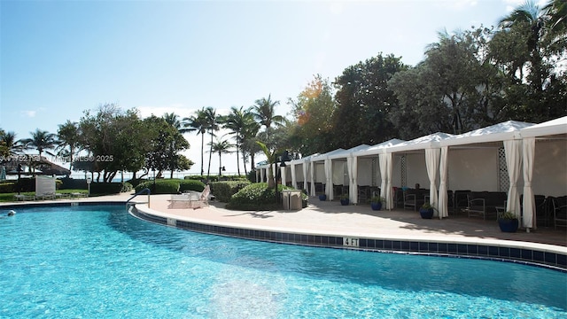 community pool featuring a patio area