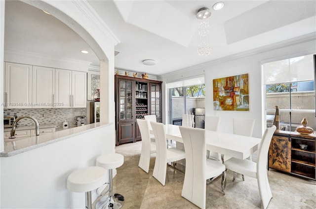 1468 Mariner Way, Hollywood, FL 33019 - dining space with ornamental molding, arched walkways, recessed lighting, and a tray ceiling
