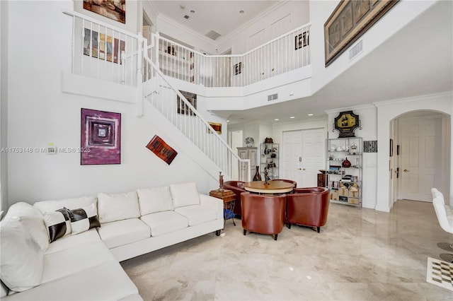 1468 Mariner Way, Hollywood, FL 33019 - living area featuring arched walkways, stairway, marble tiled flooring, ornamental molding, and a towering ceiling