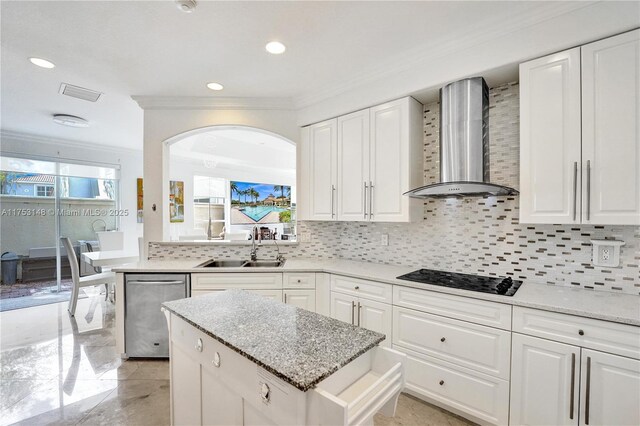 1468 Mariner Way, Hollywood, FL 33019 - kitchen featuring wall chimney exhaust hood, black electric stovetop, ornamental molding, plenty of natural light, and backsplash