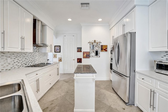 1468 Mariner Way, Hollywood, FL 33019 - kitchen featuring stainless steel appliances, wall chimney range hood, ornamental molding, tasteful backsplash, and white cabinets
