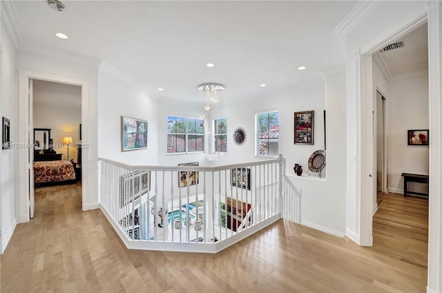 1468 Mariner Way, Hollywood, FL 33019 - hall featuring an upstairs landing, wood finished floors, ornamental molding, recessed lighting, and a chandelier