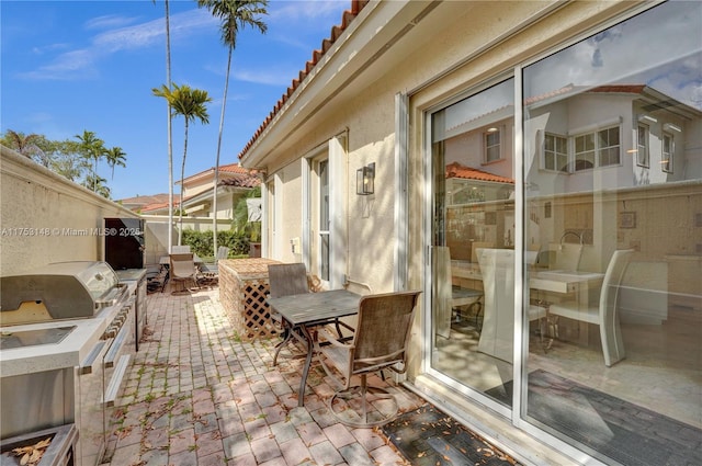 1468 Mariner Way, Hollywood, FL 33019 - view of patio featuring outdoor dining area and exterior kitchen