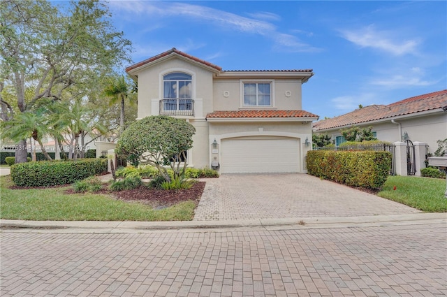 1468 Mariner Way, Hollywood, FL 33019 - mediterranean / spanish home with decorative driveway, stucco siding, a tiled roof, an attached garage, and a balcony