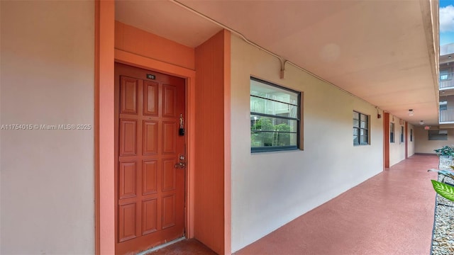 property entrance featuring stucco siding