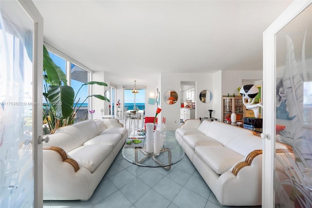 living area featuring tile patterned flooring and french doors