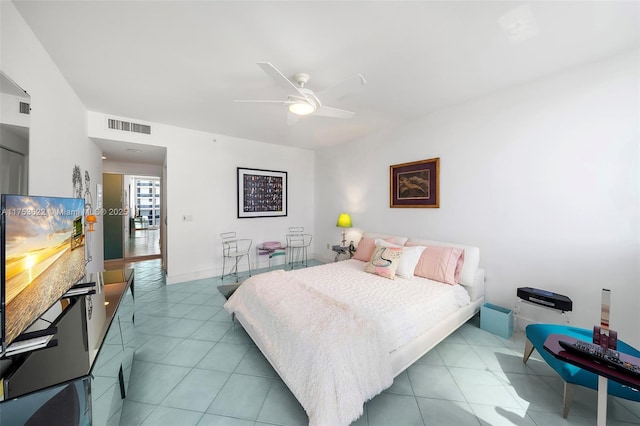 bedroom with ceiling fan, baseboards, visible vents, and tile patterned floors