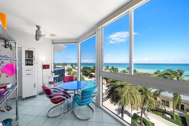 sunroom / solarium with a wealth of natural light and a water view