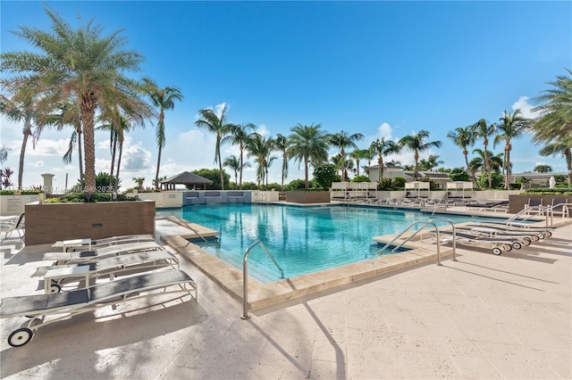 community pool featuring a patio area