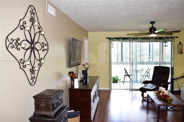 9320 Sunrise Lakes Blvd Unit 306, Sunrise, FL 33322 - living area featuring visible vents, dark wood-style flooring, ceiling fan with notable chandelier, and a healthy amount of sunlight
