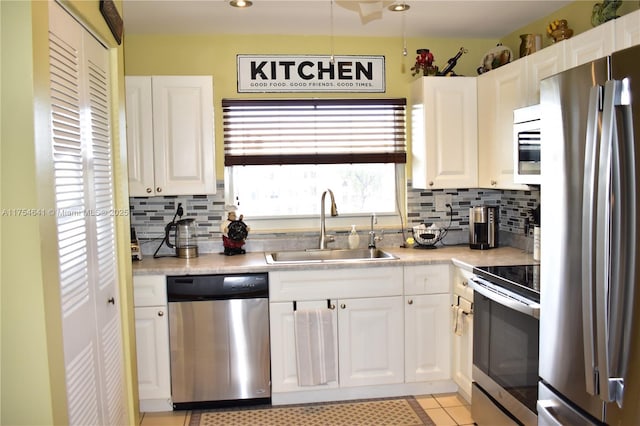 9320 Sunrise Lakes Blvd Unit 306, Sunrise, FL 33322 - kitchen with a sink, light countertops, stainless steel appliances, and white cabinetry