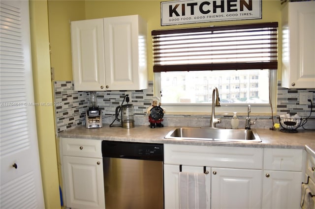 9320 Sunrise Lakes Blvd Unit 306, Sunrise, FL 33322 - kitchen featuring stainless steel dishwasher, light countertops, white cabinetry, tasteful backsplash, and a sink