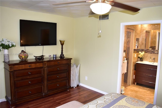 9320 Sunrise Lakes Blvd Unit 306, Sunrise, FL 33322 - bedroom with dark wood-style flooring, ceiling fan, a sink, ensuite bathroom, and visible vents