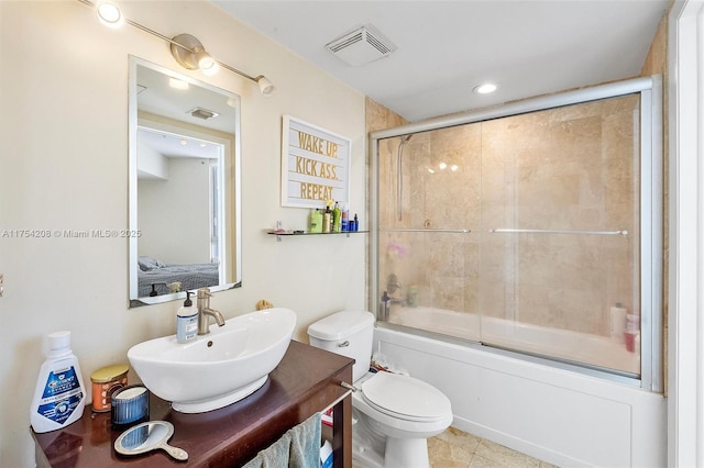 full bath with toilet, bath / shower combo with glass door, vanity, and visible vents