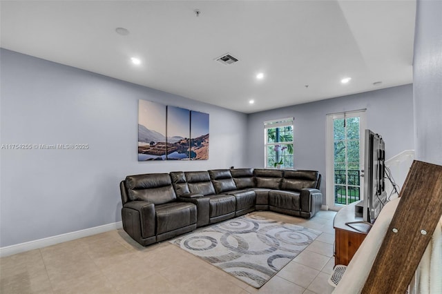 living room with baseboards, visible vents, tile patterned flooring, and recessed lighting