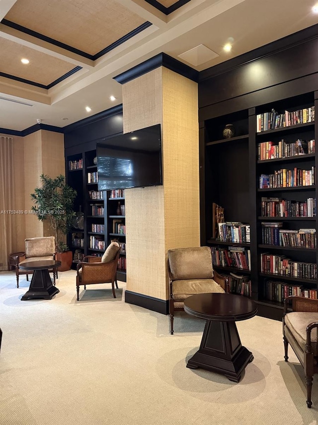 living area with built in features, carpet flooring, crown molding, and coffered ceiling