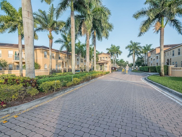 4331 SW 160th Ave Unit 108, Miramar, FL 33027 - view of road featuring curbs, a residential view, and a gated entry