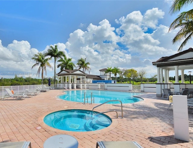 4331 SW 160th Ave Unit 108, Miramar, FL 33027 - community pool featuring a gazebo, a hot tub, and a patio