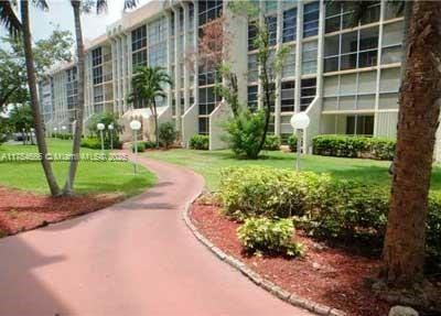 851 Three Islands Blvd Unit 411, Hallandale Beach, FL 33009 - view of home's community featuring a yard