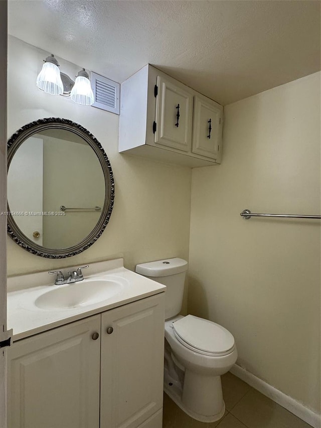 851 Three Islands Blvd Unit 411, Hallandale Beach, FL 33009 - bathroom with tile patterned flooring, toilet, vanity, a textured ceiling, and baseboards