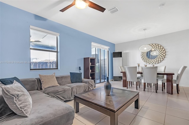 25340 SW 116th Ave, Homestead, FL 33032 - living room featuring light tile patterned floors, a ceiling fan, visible vents, and a wealth of natural light