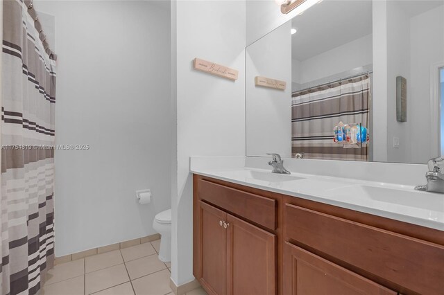 25340 SW 116th Ave, Homestead, FL 33032 - full bath with double vanity, a sink, toilet, and tile patterned floors