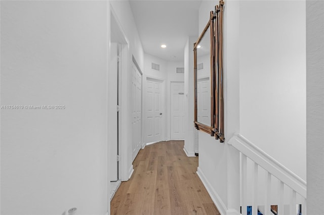 25340 SW 116th Ave, Homestead, FL 33032 - corridor with a barn door, baseboards, visible vents, light wood-type flooring, and recessed lighting