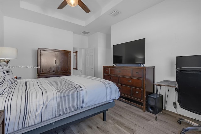 25340 SW 116th Ave, Homestead, FL 33032 - bedroom featuring a raised ceiling, visible vents, and light wood-style flooring
