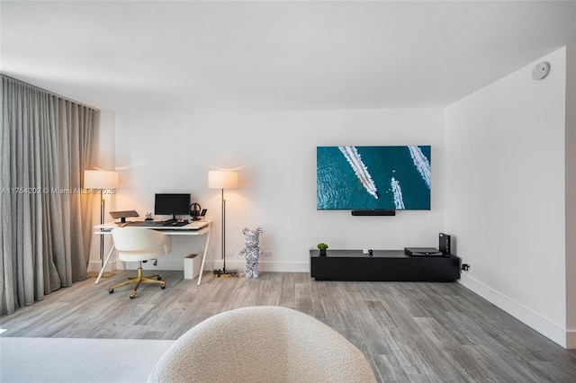 office featuring wood finished floors and baseboards